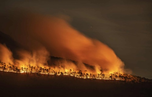 Fire burns along the western ridge of Pilot Mountain, North Carolina, Walt Unks, 2021