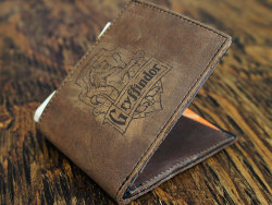 wickedclothes:  Harry Potter House Crest Leather Wallets Although these genuine leather wallets are ideal for wizards, they work just as well for holding muggle money. Available in various colors. Sold on Etsy. 