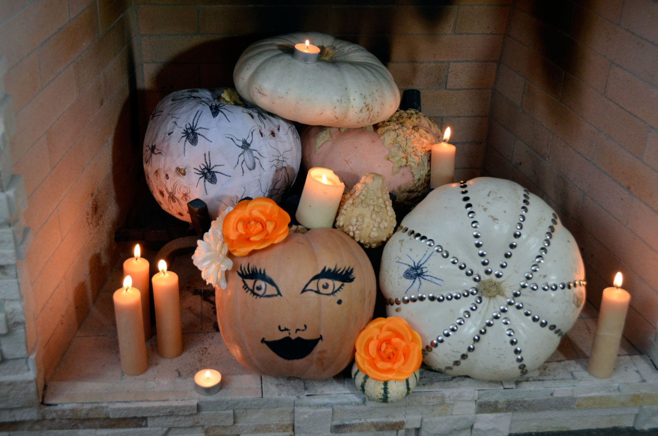 Looking for an easy Halloween decor idea? Try arranging decorated pumpkins or jack-o’-lanterns in the fireplace.