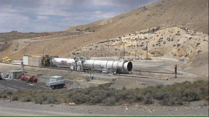 This GIF shows a full-scale solid rocket booster being tested at Northrop Grumman’s facility in Utah. The booster, laying horizontal, ignites and fires. Image credit: Northrop Grumman