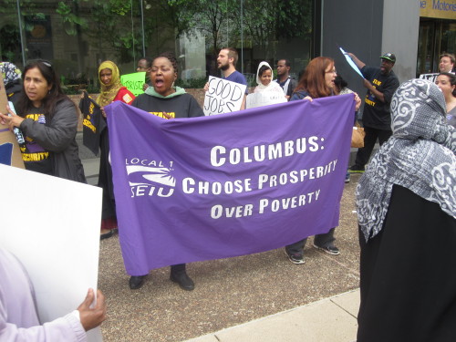 Columbus janitors, security officers and community members rallied on Monday to call on business lea