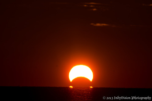 kenobi-wan-obi:  An Omega Sunrise Eclipse     The November 3rd sunrise eclipse over the Chesapeake Bay, from Chesapeake Beach in Maryland. These are stills from a time-lapse sequence I shot of the eclipsed sunrise. - Indy 