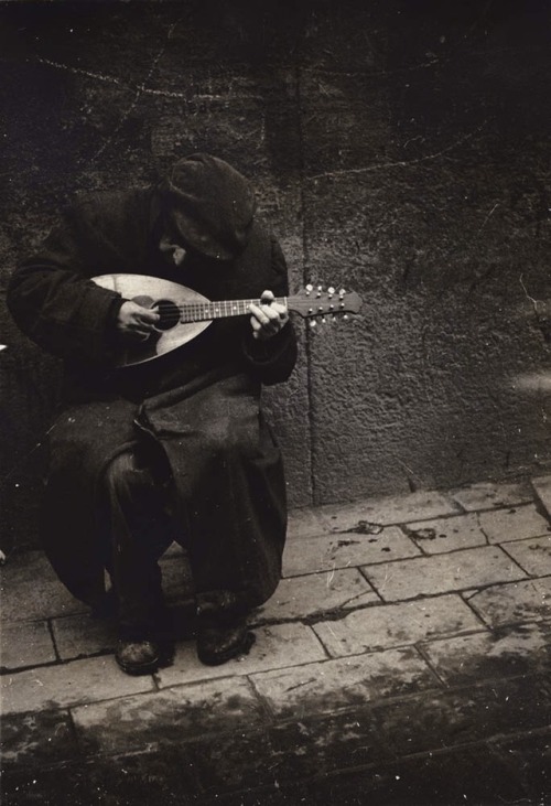 zzzze:J. Bertolino Man Playing Mandolin (from “Family of Man”),1950Gelatin silver print
