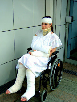 brokenlegsblog:  Poor girl with bandages and casts on a wheelchair