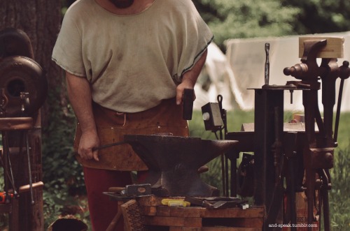 one of my smithy friends working his forge last weekend[image description: four photos of a white ma