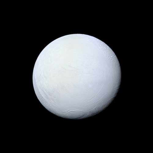 Saturn’s moon Enceladus, covered in snow and ice, resembles a perfectly packed snowball in thi