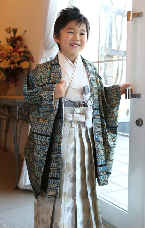 Japanese boy in his best traditional clothing: kimono and hakkama