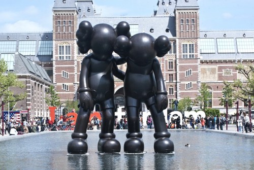 supersonicart:   KAWS in Amsterdam. KAWS recently put up three new sculptures in Amsterdam as part of this year’s ArtZuid 2015.  These sculptures are titled “Along the Way,” (The two figures standing together), “At This Time,” (The lone statue