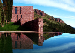 archatlas:  A House Born from the Mountain in ValenciaA mountain landscape, with large retaining walls of stone, is the origin of the design for this house layout. Located in a housing state in Sagunto, Valencia, at the base of the Calderona Range, the