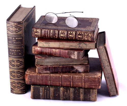 worn odd leather bound volumes from the 19th century and earlier