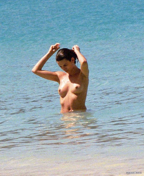 toplessbeachcelebs:  Penelope Cruz (Actress) swimming topless on the beach (February 2002) 