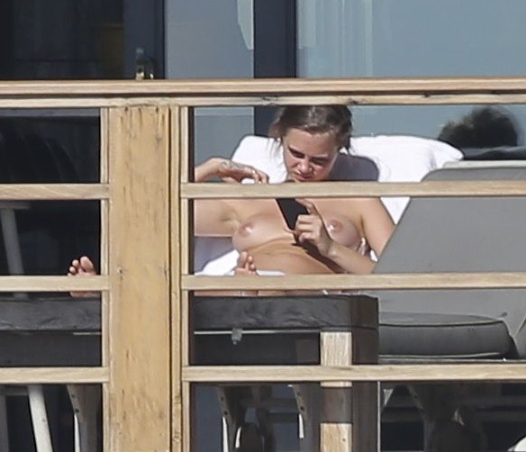 celebhunterextra:  Cara delevingne enjoying the sun topless in a bikini  More at