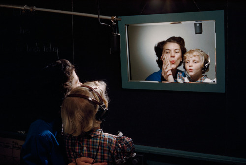 natgeofound:A teacher and a deaf student practice making sounds in front of mirror at the Clarke Sch