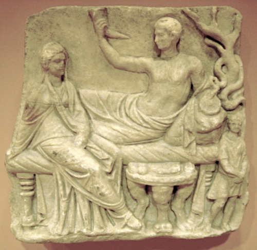 lionofchaeronea: Ancient Roman grave relief, depicting the deceased man and his wife as guests at a 
