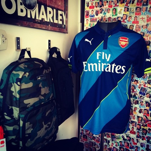 PUMA Arsenal 2014/2015 Cup Jersey 🏆 - PUMA Striker Footwear Bag - PUMA Camo Outlier Backpack. Jersey available in long sleeve also @villagesoccershop #puma #pumafootball #pumasoccer #pumalifestyle #arsenal #afc #arsenalcupjersey #championsleague...