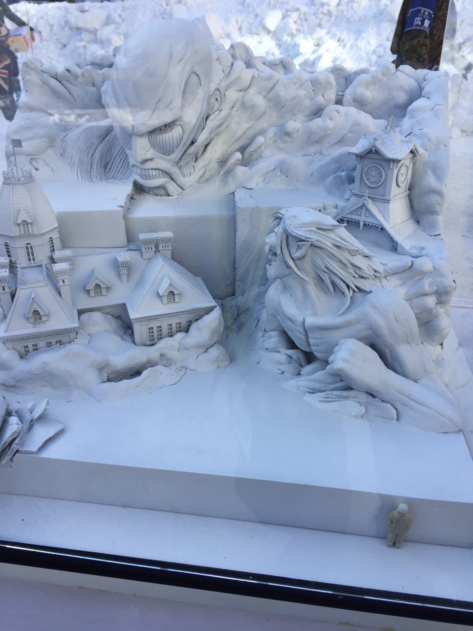 Close-ups of the Colossal Titan model and actual snow sculpture under construction,