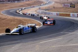 steel-and-asphalt:  A long train of cars winds up the hill at Riverside.CART PPG IndyCar World Series, Riverside International Raceway, 1982 AirCal 500