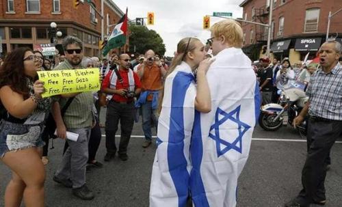 Picture of the day: Two brave Israel supporters in the middle of a Pro Hamas rally held on Sunday in Ottawa.