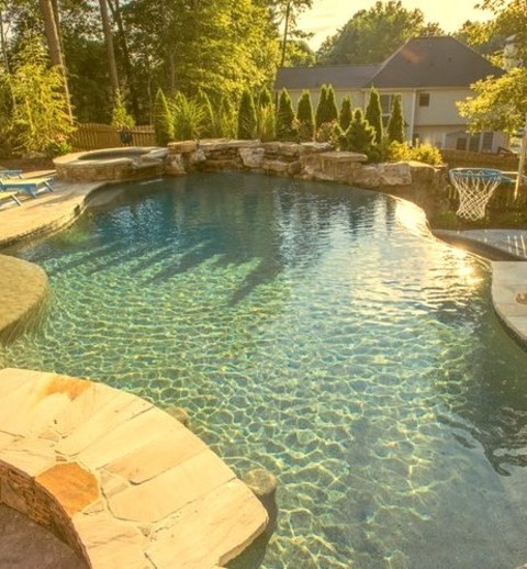 Tropical PoolLarge Tropical Backyard Stone And A Uniquely Shaped Infinity Water Slide Are Ideas For A