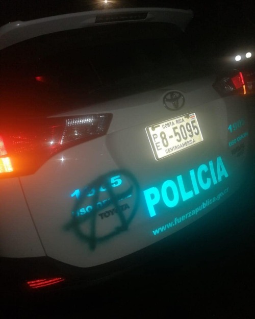 Cop car vandalized during a student protest in Costa Rica