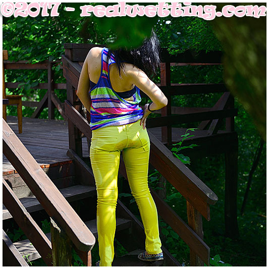 realwetting:  After a walk in the garden, Monica is deliberately wetting her yellow