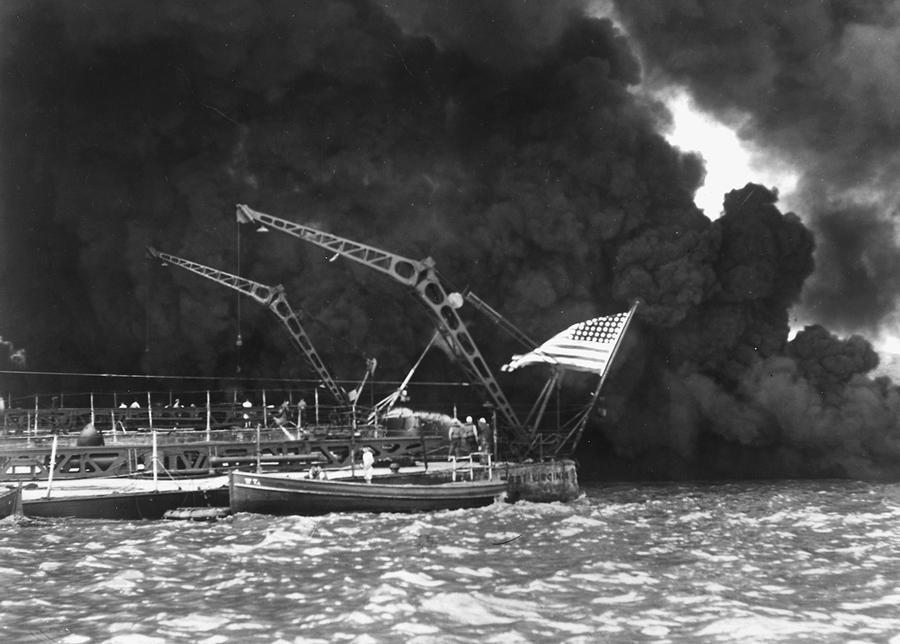 demons:  A U.S. flag flying from the stern of the sunken battleship USS West Virginia/7 December