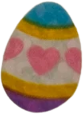 sticker of an easter egg with blue and purple ends, and a gold-trimmed pink section decorated with hearts across the center. it has a shiny foil finish.