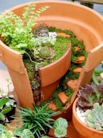 p0lski: sixpenceee:  A creative way to reuse a broken pot.   I’ve done this before. In fact, i broke a pot to do it as it looks so much better than a nice neatly potted plant! 
