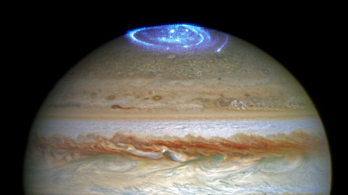 Like Earth, Jupiter is home to polar auroras that light the sky as charged particles interact with t