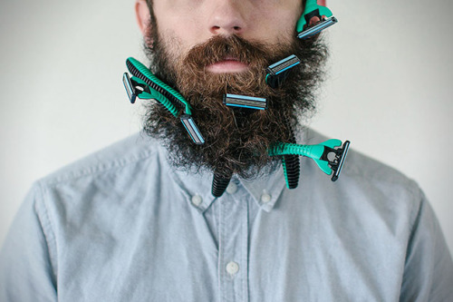 brain-food:  Photographer Stacy Thiot’s Tumblr project, Will It Beard, involves her husband’s beard and sticking as many unusual things as she can find in the thick thicket of facial hair—and then taking photographs of it. 