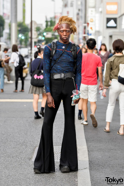 tokyo-fashion:  Tokyo-based fashion model Zelig on the street in Harajuku wearing a camouflage top with Zara flare pants and Yosuke platform boots. Check his YouTube videos for a humorous take on modeling life in Japan. Full Look