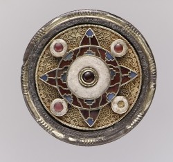 heaveninawildflower: Anglo-Saxon Disk Brooch (early 600′s). Gold with garnets, glass, and niello. England.  Image and text courtesy The Met. 