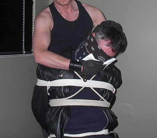 jhardcastle1976:  blackleatherbikerjacket:  “The Perils of Paul” Serial Part 5:  Paul is dragged by his kidnapper, still bound and gagged, to a tub.  Paul can only listen to the water as it is being poured into the tub.  The kidnapper