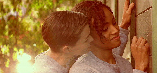 girls kissing in bedroom