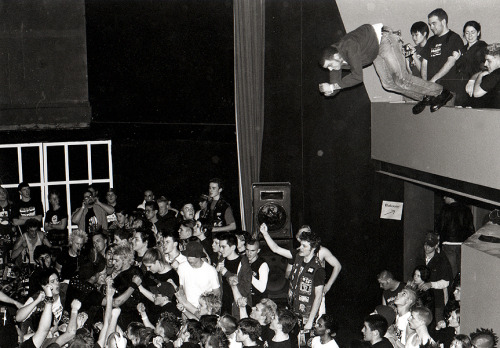 theunderestimator:  Boston hardcore punk photographed by Matt Caroll while jumping off the second floor balcony onto the crowd below during a punk live gig featuring The Explosion, :30 Seconds Over Tokyo, The Pinkerton Thugs, Anti-Flag, The Unseen, and