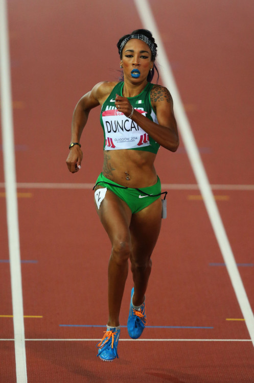 hersheywrites:olympic88:Dominique Duncan of Nigeria  Glasgow 2014 Commonwealth Games  Blue Lipstick on the track? Yaaaaaaaasssss *is given life* 