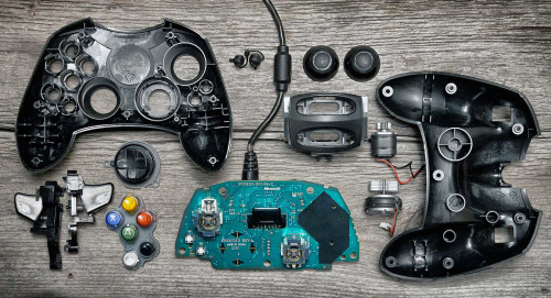 cinemagorgeous:  Many generations of game controllers, taken apart by Brandon Allen. 