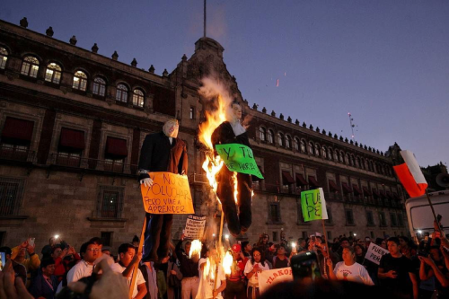 Burn, baby, burn! Trump and Peña Nieto burn in effigy in Mexico City’s Zócalo at the culmination of 