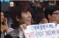 yooja:  Kyuhyun holding up a sign that says “Don’t watch Gayo Daejun” whilst at the MBC Entertainment Awards  