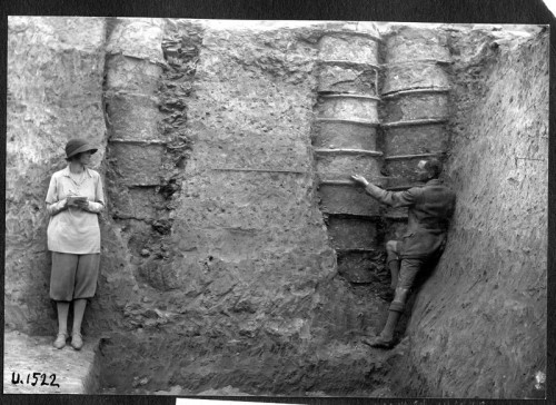 Katharine and Leonard Woolley measuring drainage pipes in Pit X at Ur(1934).Irrigation was the drivi
