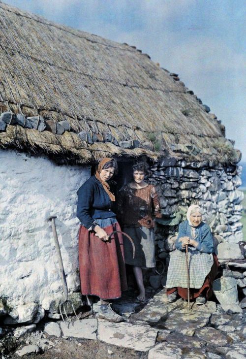 robert-hadley:Three generations of peasant women stand outside their stone cottage, Ireland, 1927. P