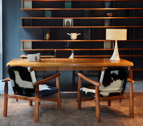 CHARLOTTE PERRIAND, Armchairs in cowskin (1935/1955), desk in ash wood and black formica (1954) and 