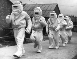 enrique262:  stripesandrockers: (source, pic #22) (Getty Images source) A demonstration of asbestos fire fighting suits, designed for the Fleet Air Arm for rescuing airmen trapped in blazing aircraft. October, 1940. Photographer: William Vanderson. 