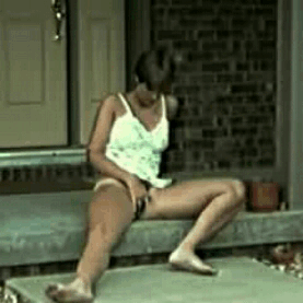 hairytrianglelover: My wife Jana and I on our front porch, facing the street.