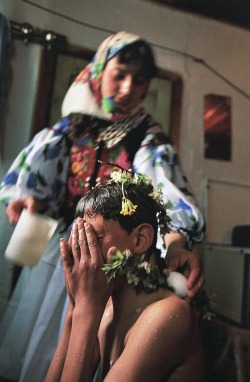 praguehead:Albania: a girl washes her brother