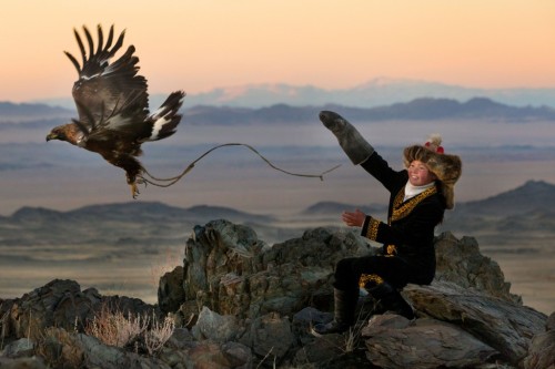 13 year old Mongolian huntress Ashol Pan and her golden eagle.Photos by Asher Svidensky