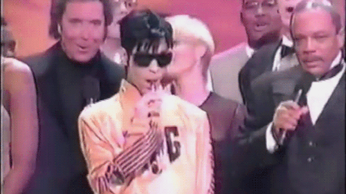 whitemenareboring: tilyourloveisred: Prince and his lollipop during We Are the World performance, 19