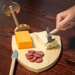 laughingsquid:A Shield Shaped Medieval Cutting Board Equipped With Two Battle Axes and a Spear