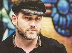 bearchaser:  let me try to sum up why this face is classily handsome and damn near perfect (for me): the full beard, the wide, chiseled jaw, the slightly pudgy tip of the nose, and perhaps most important, the downturned shape of the eyes that give him