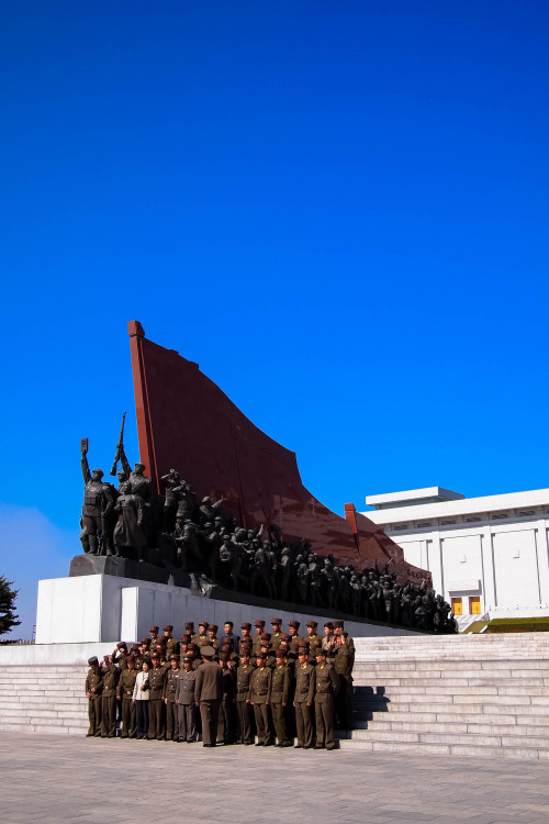 Korean soliders in front of Mansu Hill Socialist Revolution monument Pyongyang, DPRK 2013